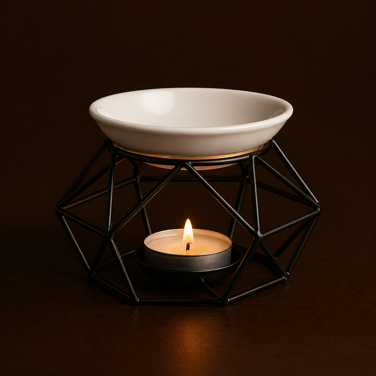 Ceramic bowl on a geometric black stand with a lit candle inside, against a dark background