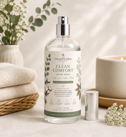 Room spray bottle labeled 'Clean Comfort' by Polished Wick on a neutral background with decorative elements.