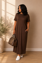 Woman wearing coffee dress with fancy handbag this is what luxury looks like 