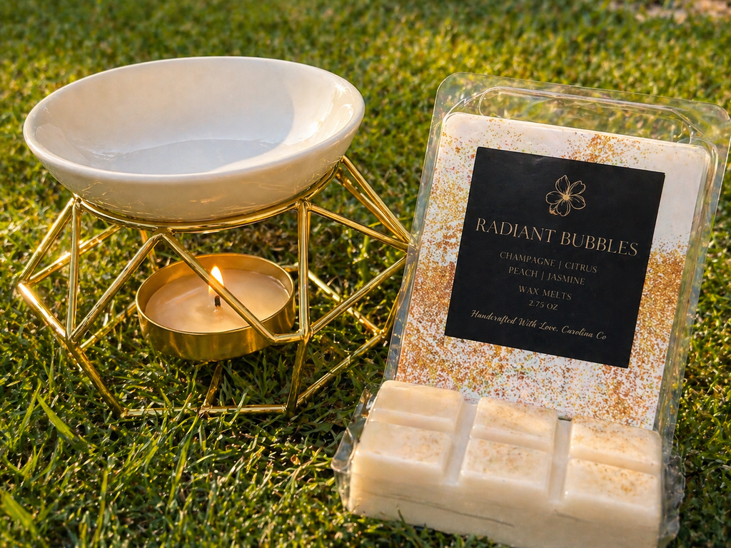 Radiant Bubbles wax melts with a lit candle in a decorative holder on grass.