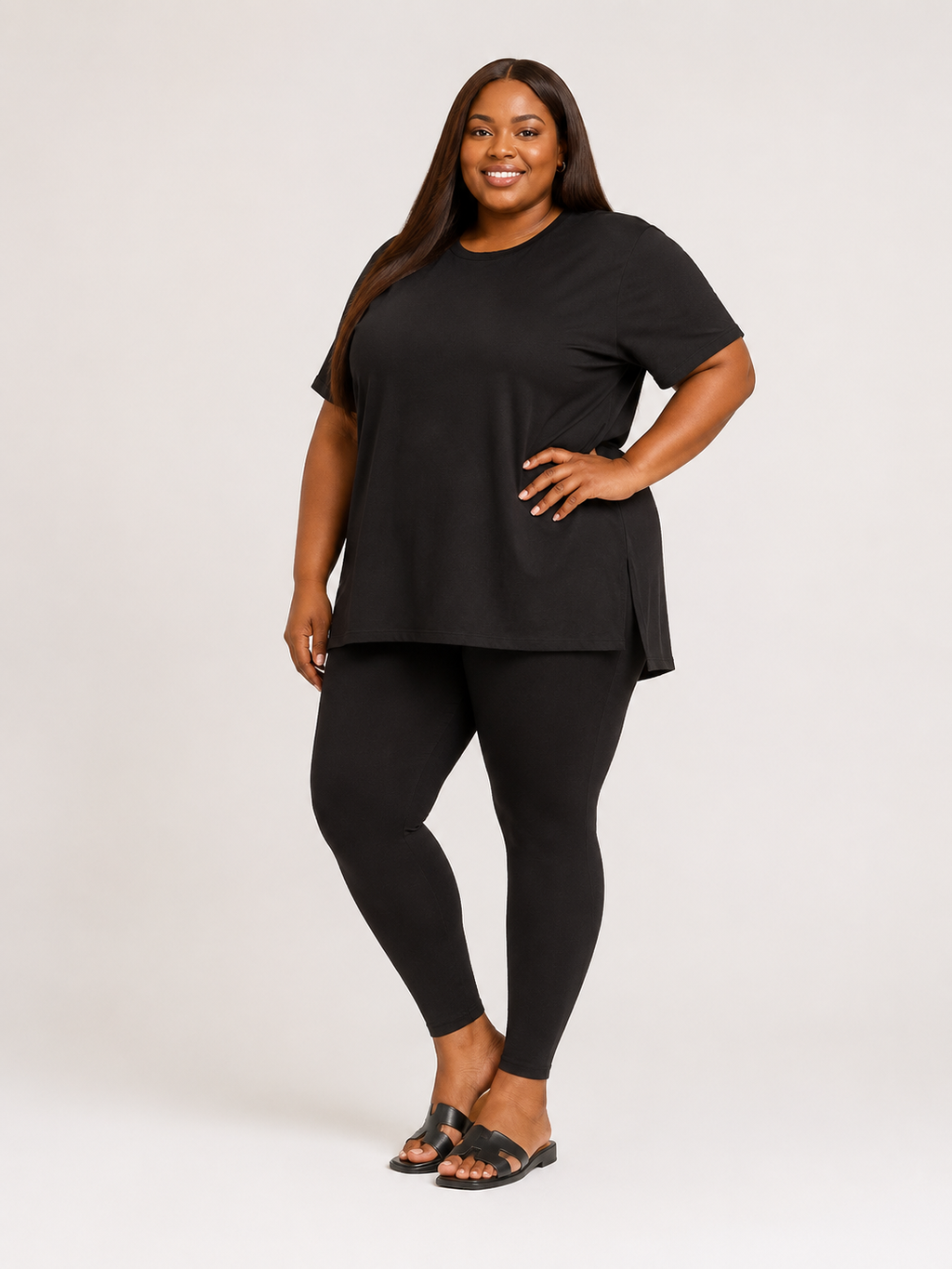 Woman wearing a black outfit on a white background